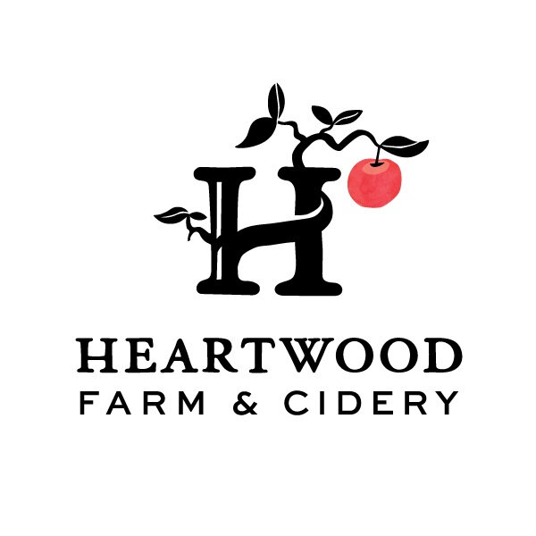 Logo for Heartwood Farm & Cidery. It features an illistrated "H." Branching off the letter is a green tree branch with a red apple on its end. Underneath the H in black is the companies' name